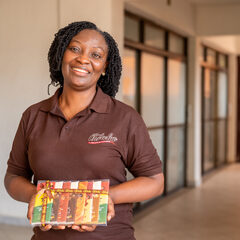 Monica Nana Ama Senanu holds box of Chocolub chocolates