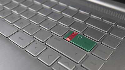 Computer keyboard that shows Turkmenistan flag on enter key