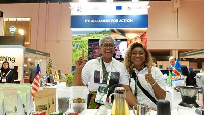 Two African women display their coffee products at trade show